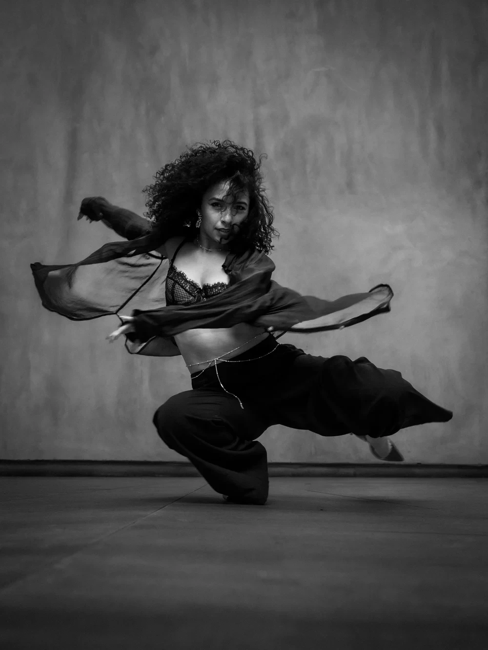Black-and-white photograph of dancer Mirna Moreno in motion