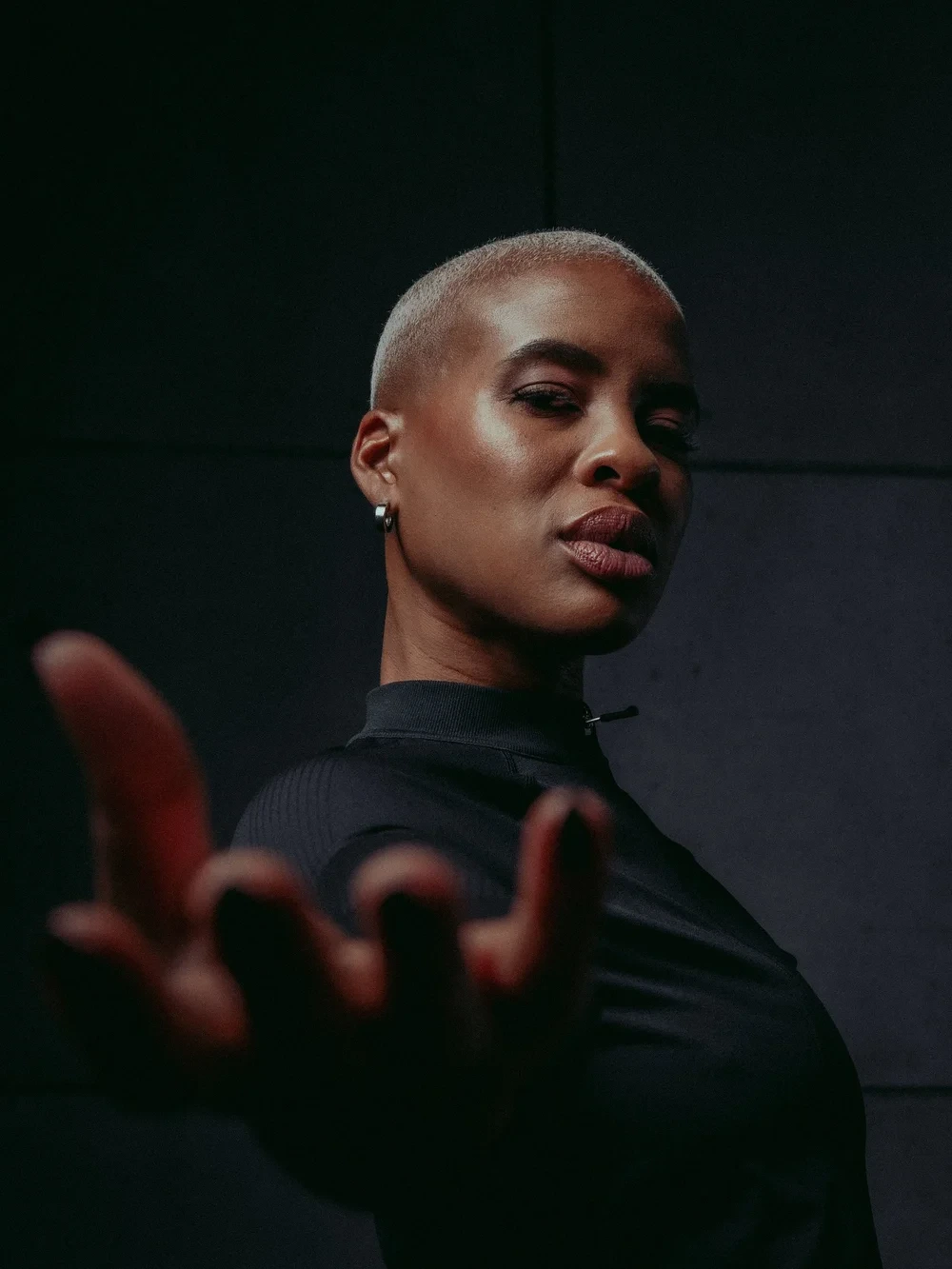 Close portrait from Strong: Nike Spec, reaching toward the lens