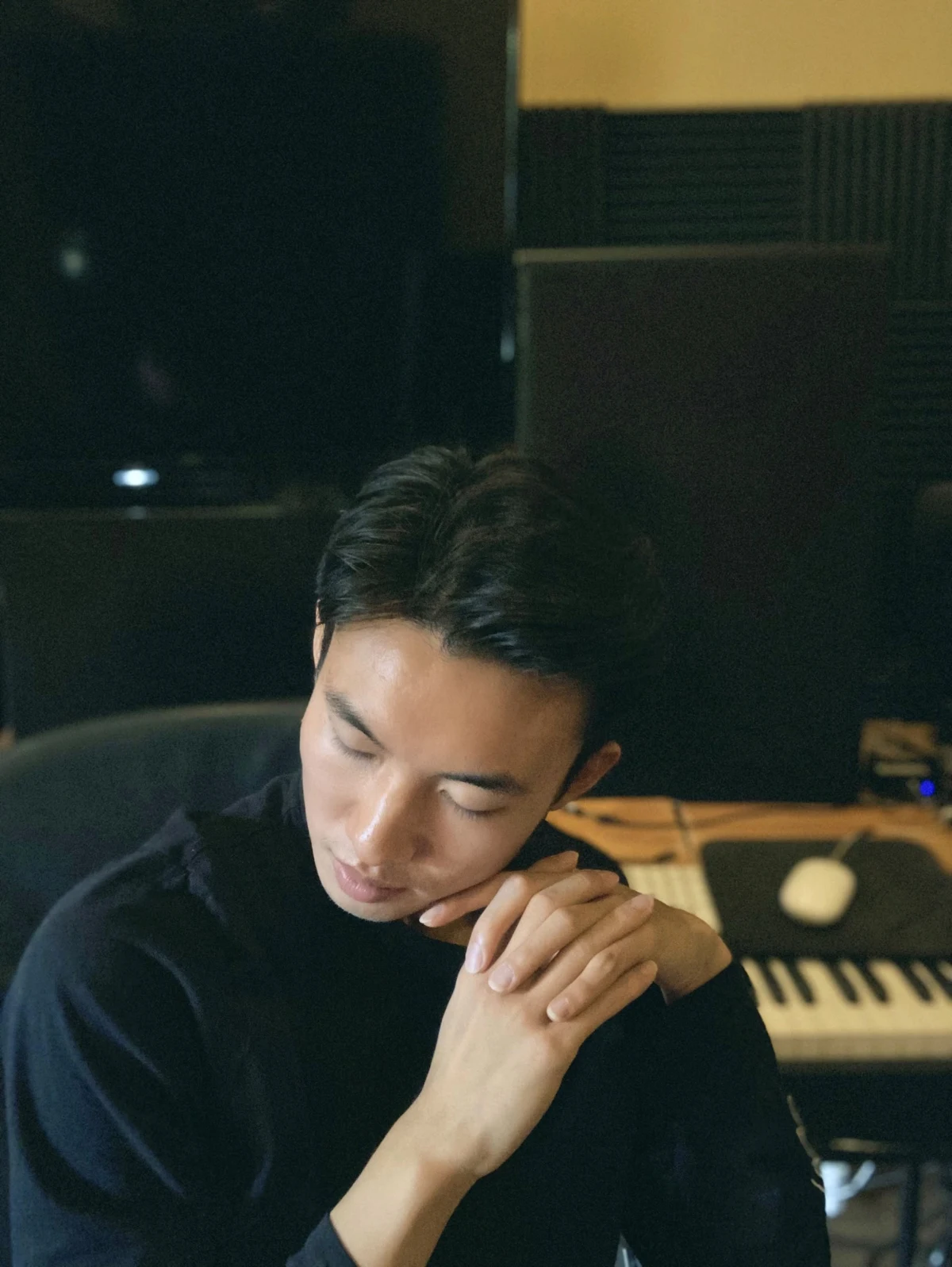 Darren Huang at a music studio keyboard