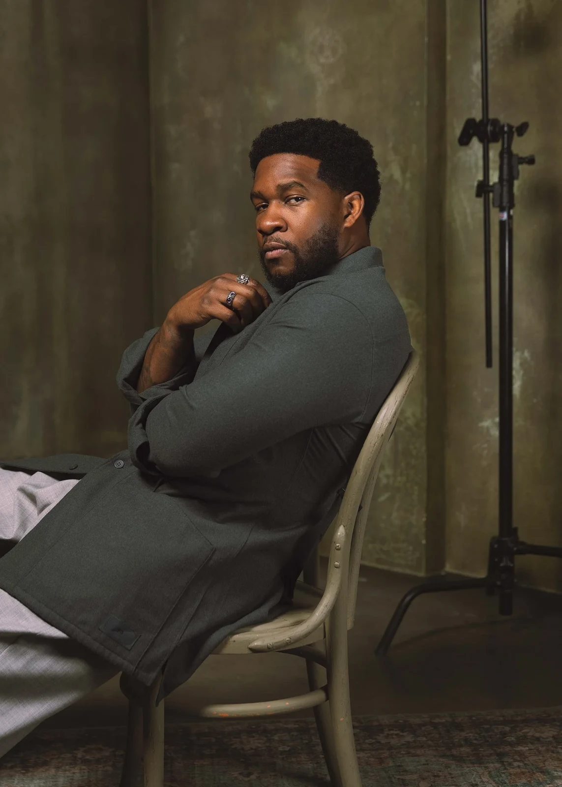 Osy Ikhile seated in his photography studio
